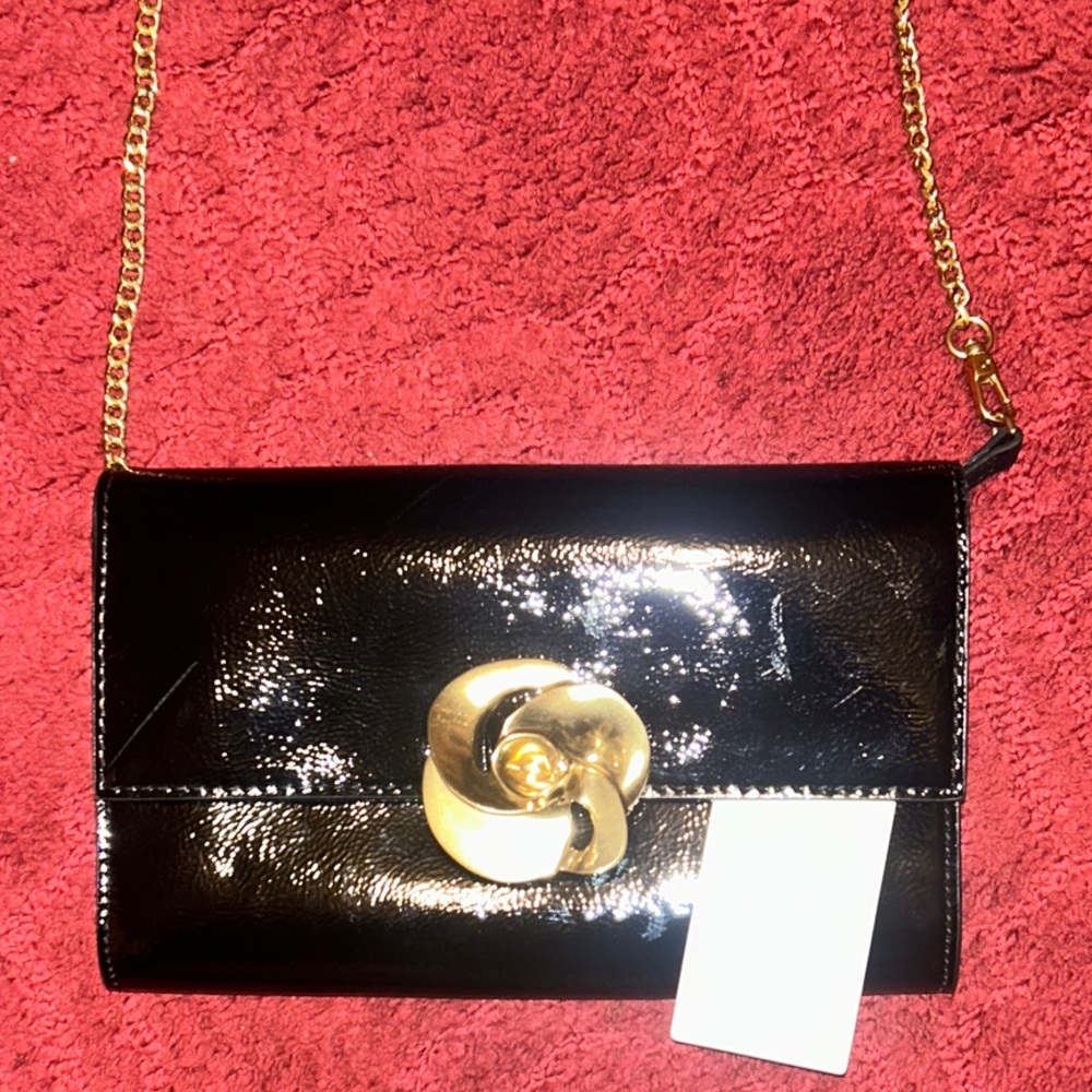 Elegant Black and Gold Clutch with Chain by Ted Baker